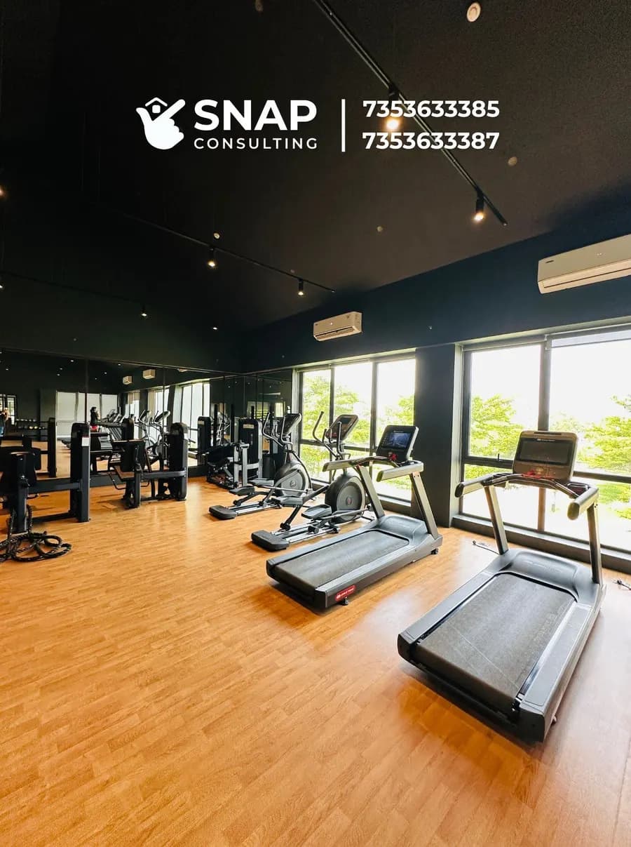 Indoor gym with treadmills at Assetz Marq clubhouse