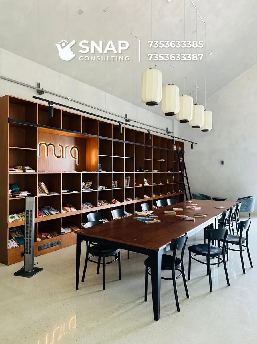 Reading room with bookshelves at Assetz Marq