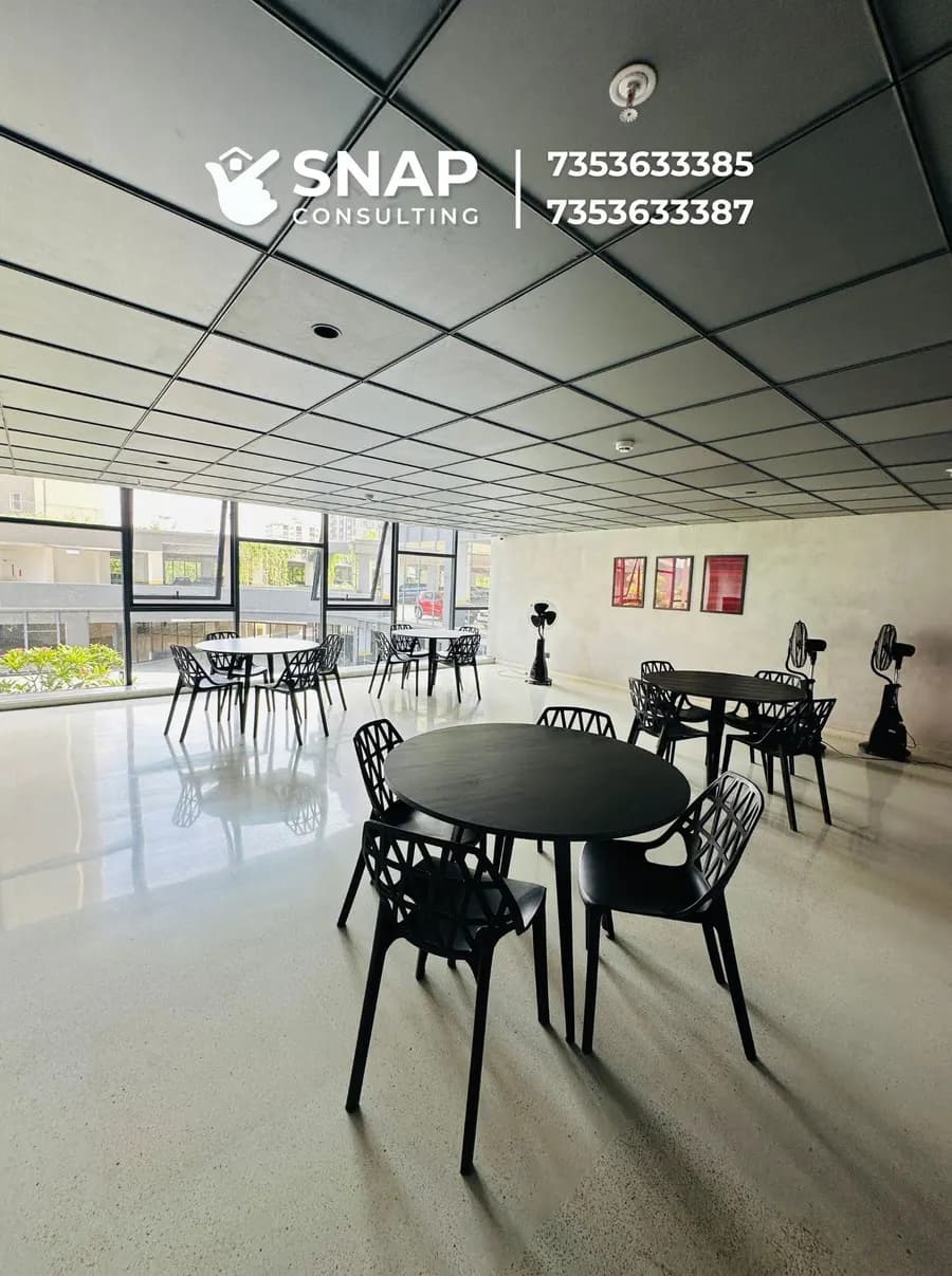 Multipurpose hall with tables at Assetz Marq clubhouse